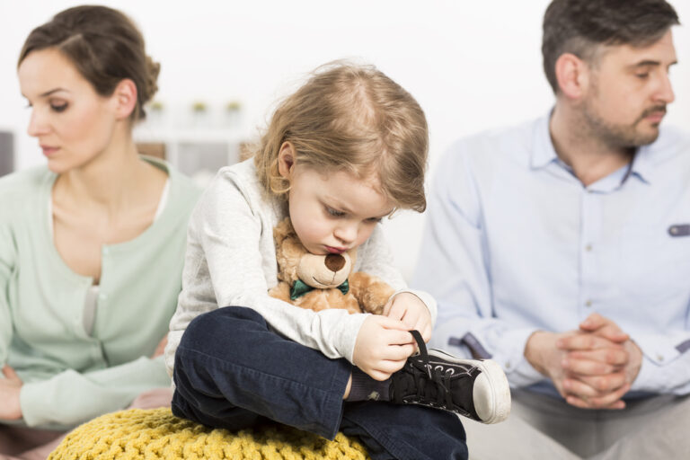 Photo,Of,A,Gloomy,Young,Family,With,A,Sad,Little