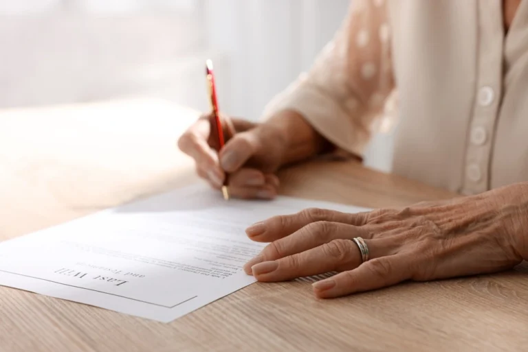 A woman signs her will in California.